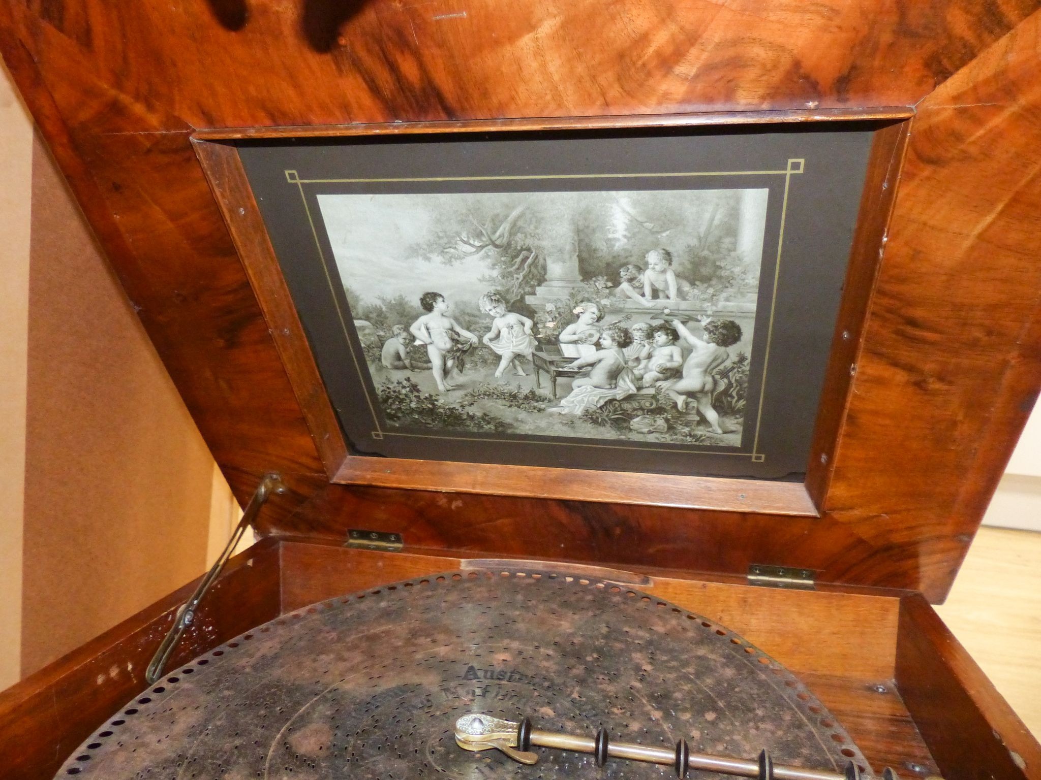 A Walnut and marquetry cased polyphon, 54cm and various 40cm discs